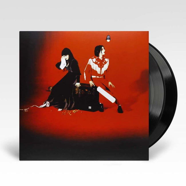 A vinyl LP record of The White Stripes' album 'Elephant' with a red background and an illustration of the band members on the cover.
