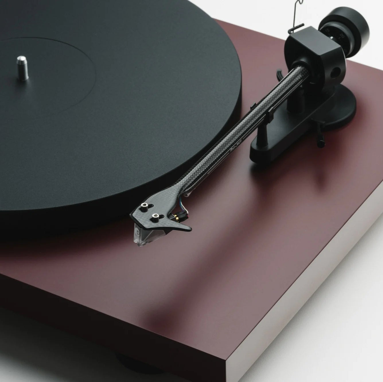 close up of turntable-weight on on Pro-Ject Debut EVO 2 record player, precision-engineered, high-torque motor, sleek modern design