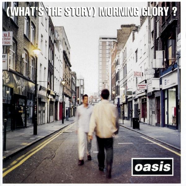 The album cover of Oasis - (What's the Story) Morning Glory? featuring two men walking down a street in front of a record store.