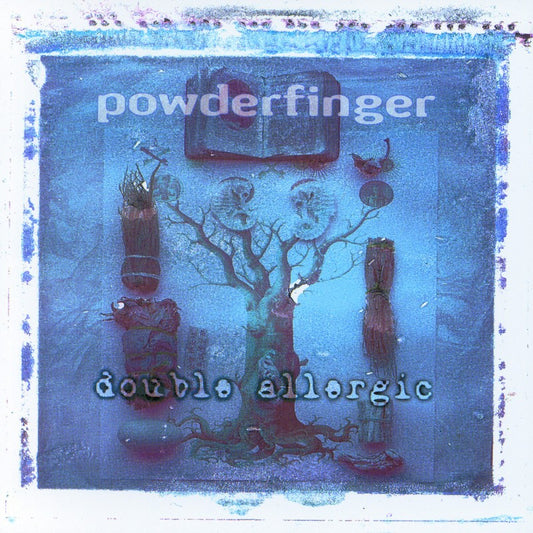 A vinyl LP cover of Powderfinger's 'Double Allergic' album featuring a blurred image of a tree with decorations and the band's name.
