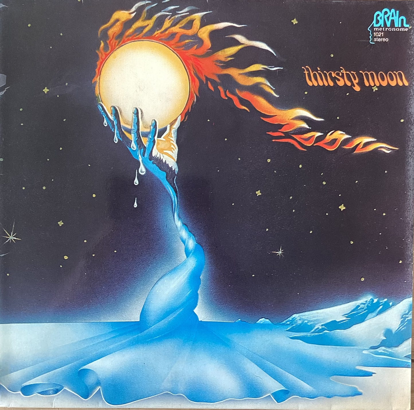 Vinyl LP cover featuring a stylized graphic design with a sun and flames motif, and text that includes the title 'Thirsty Moon'.